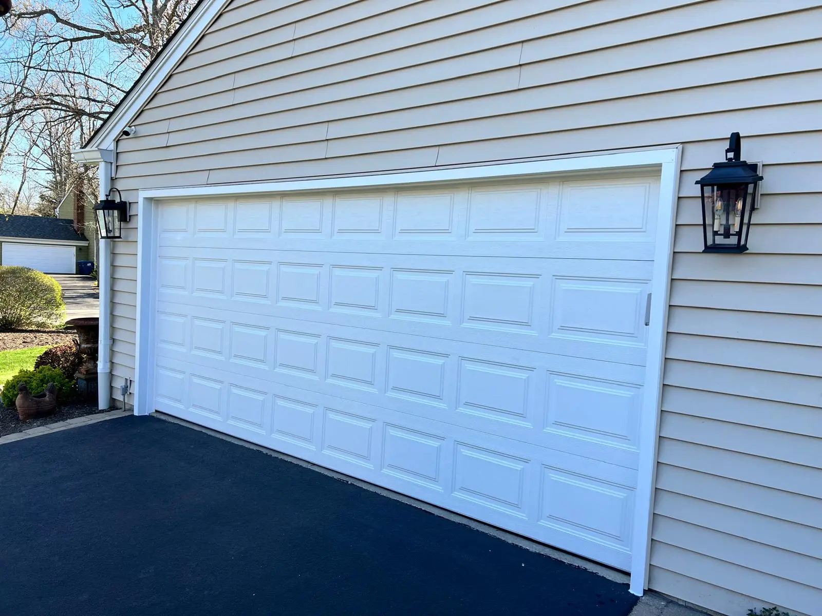 Aluminum capping installed around a garage door opening for exterior trim protection